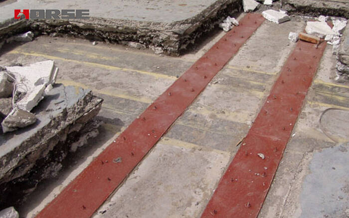 усиленный приклеенной стальной пластиной